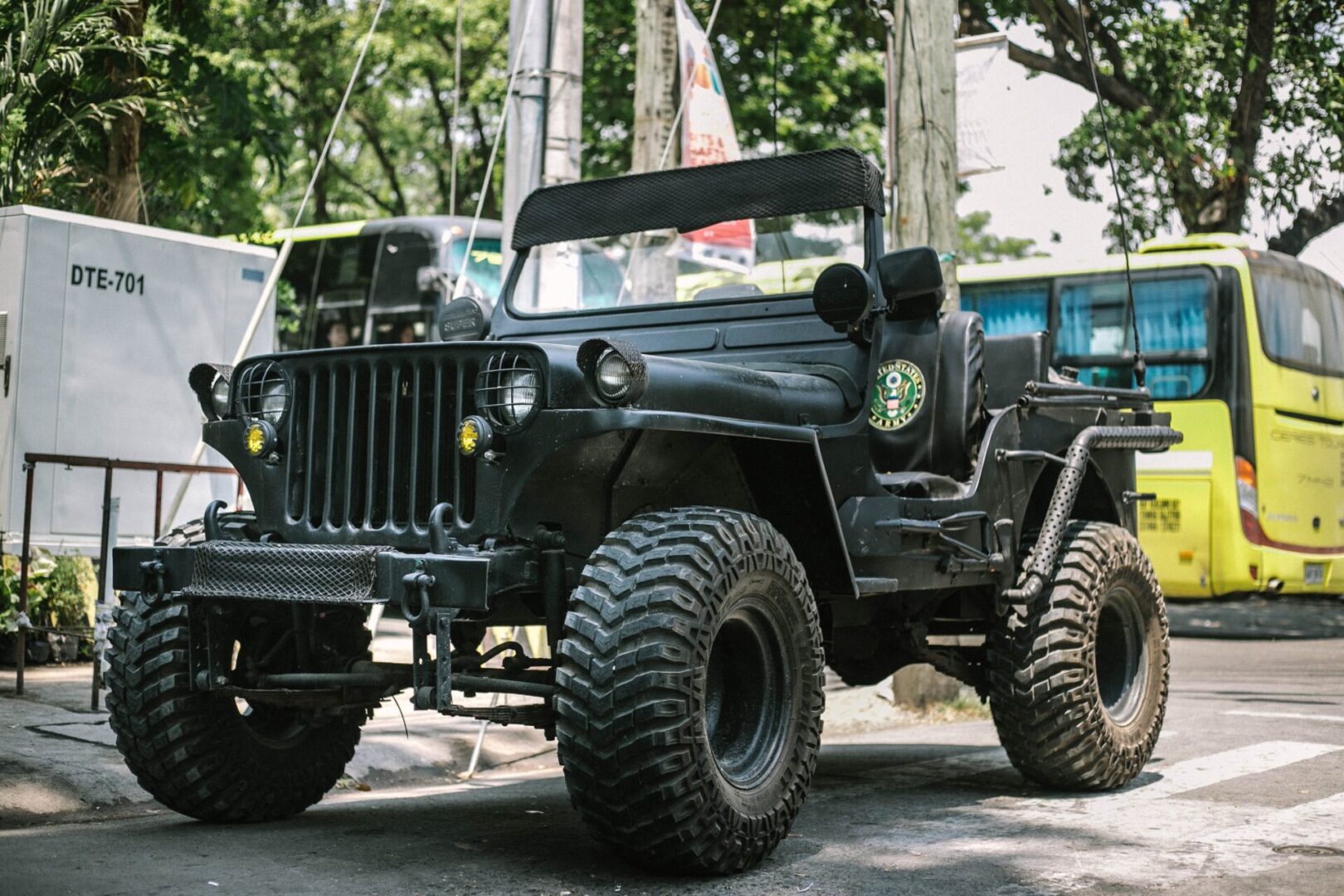 black-jeep-across-yellow-bus-2306890